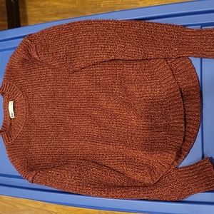 A sweater, yarn like material thick so cold weather won't get in.